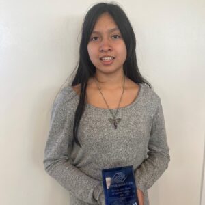 2023 Junior Youth of the Year, Samantha, holding her award