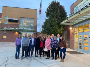 A group from United Way of Larimer County and Boys & Girls Clubs of Larimer County posing in front of the new Loveland Childcare Campus