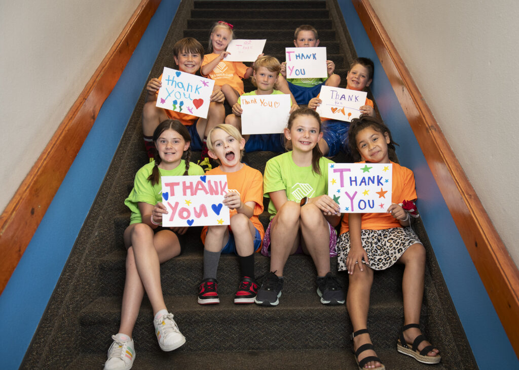 Club Kids holding Thank You signs