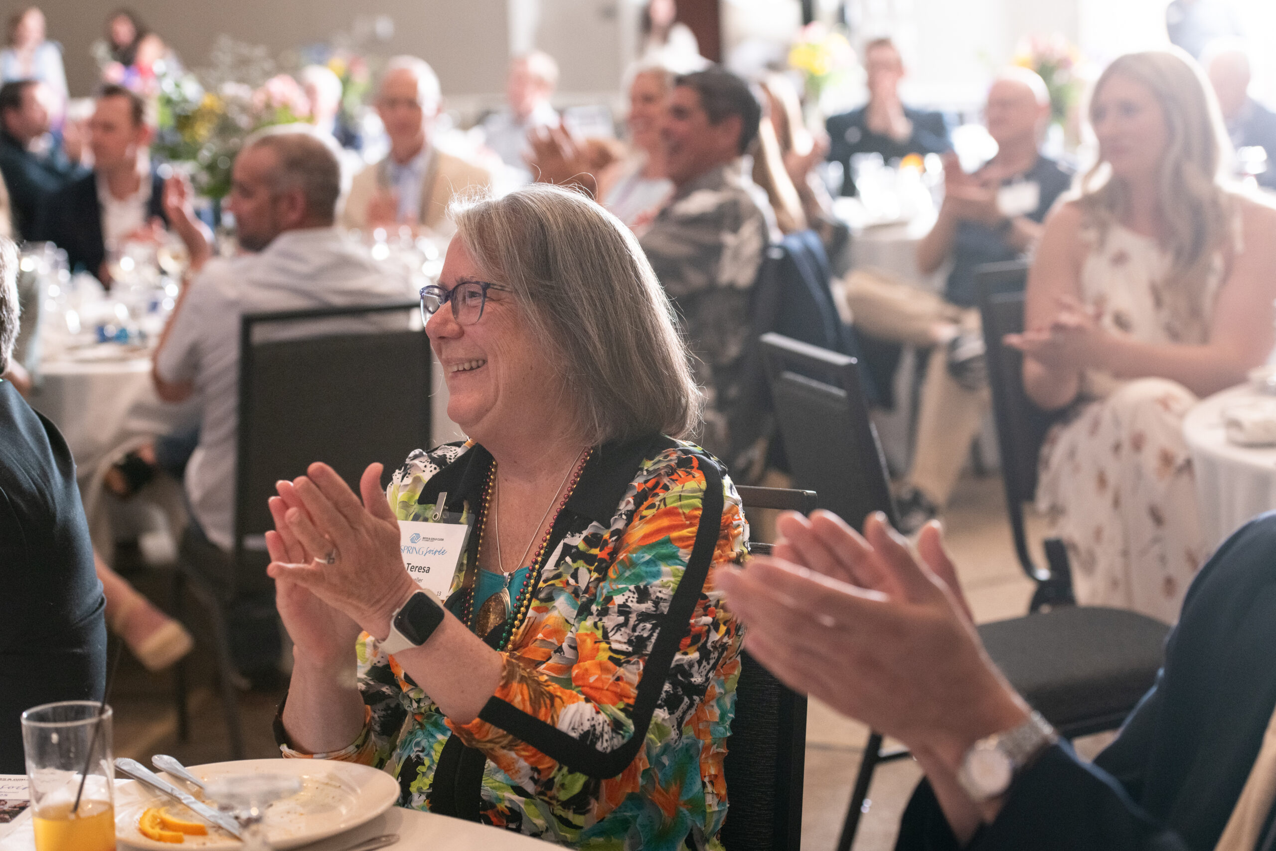 attendee clapping at the spring soiree 2025