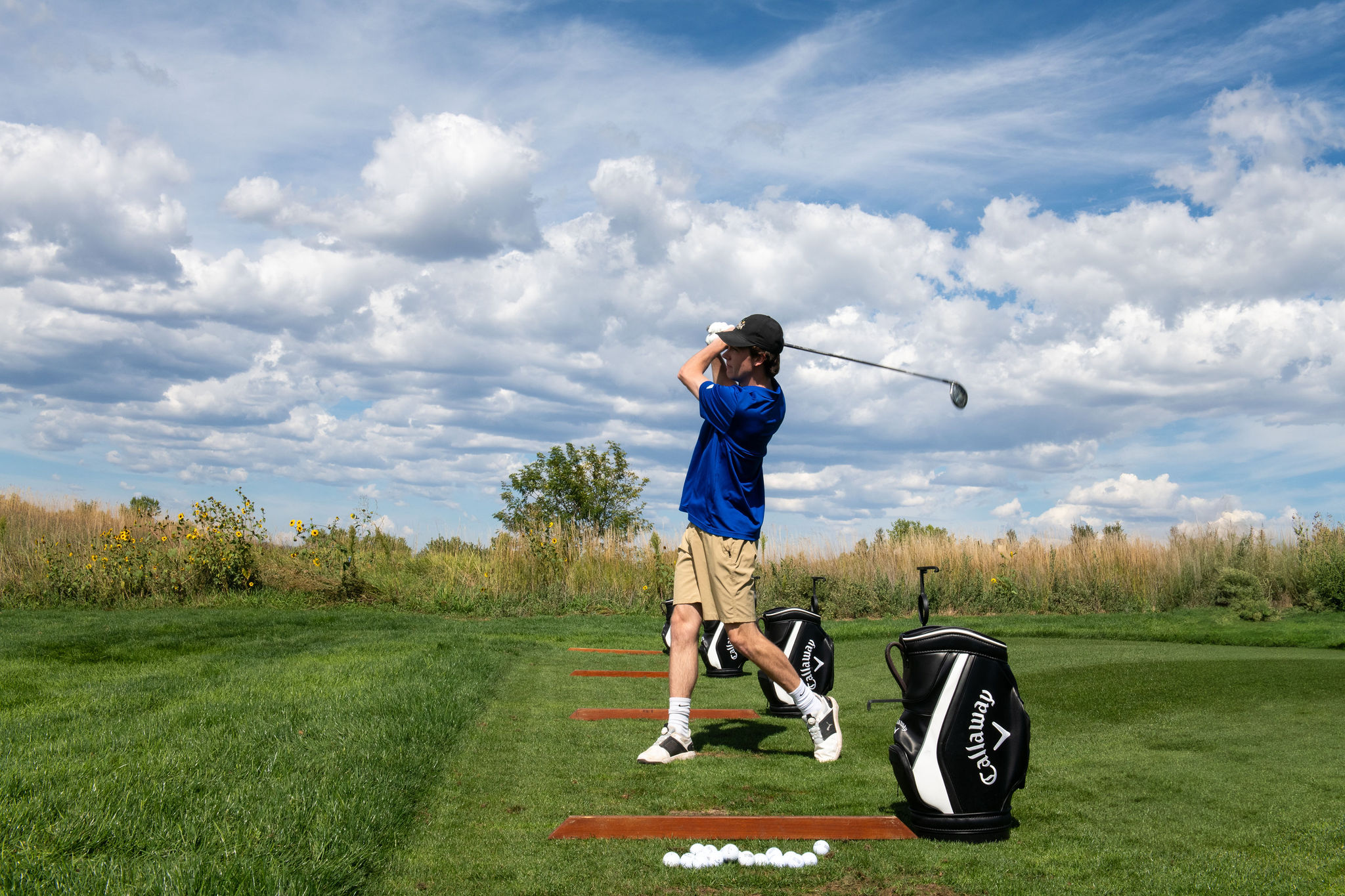 Player swinging at the 2025 Fore the Kids Golf Tournament