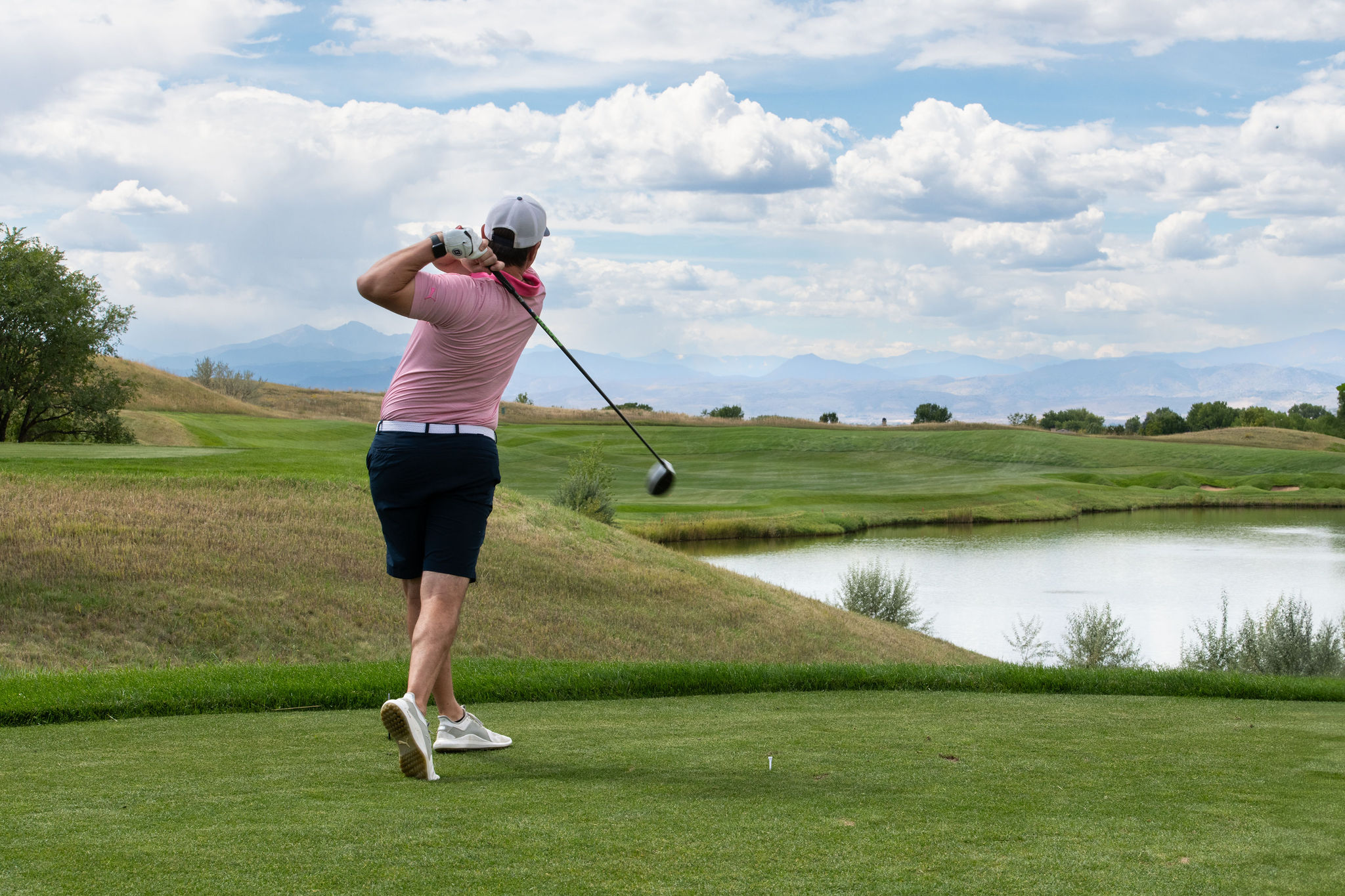 Player swinging at the 2025 Fore the Kids Golf Tournament