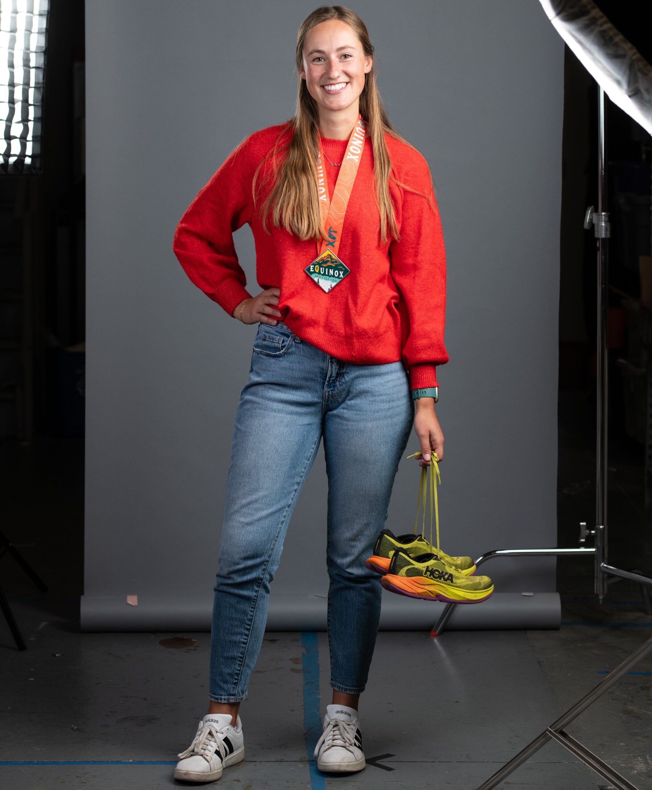 Macey VanDenMeerendonk holding running shoes