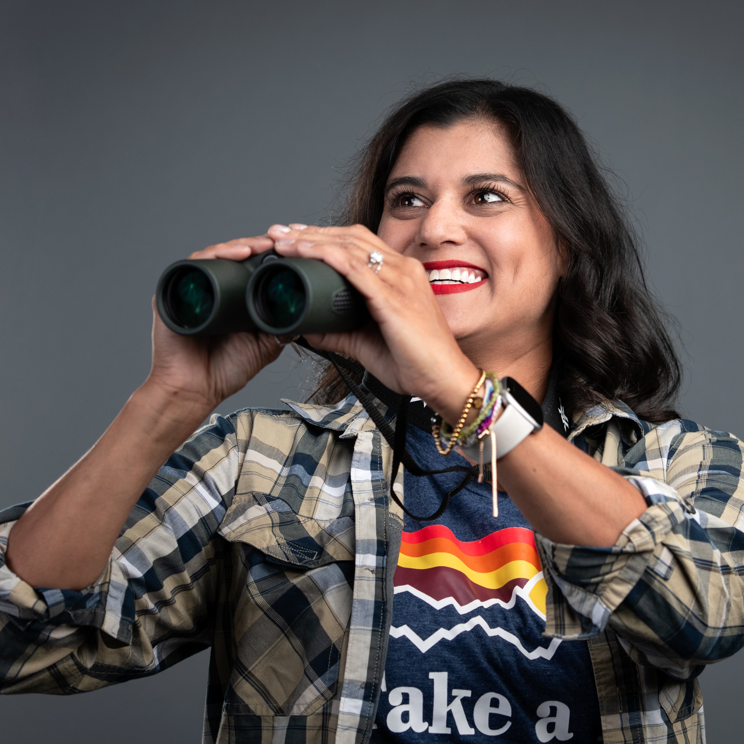 Nicole Adkins holding binoculars