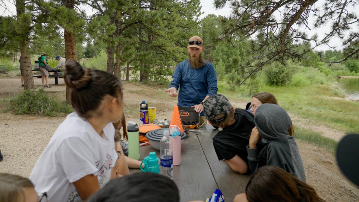 Picture of Staff teaching Members about the outdoors.