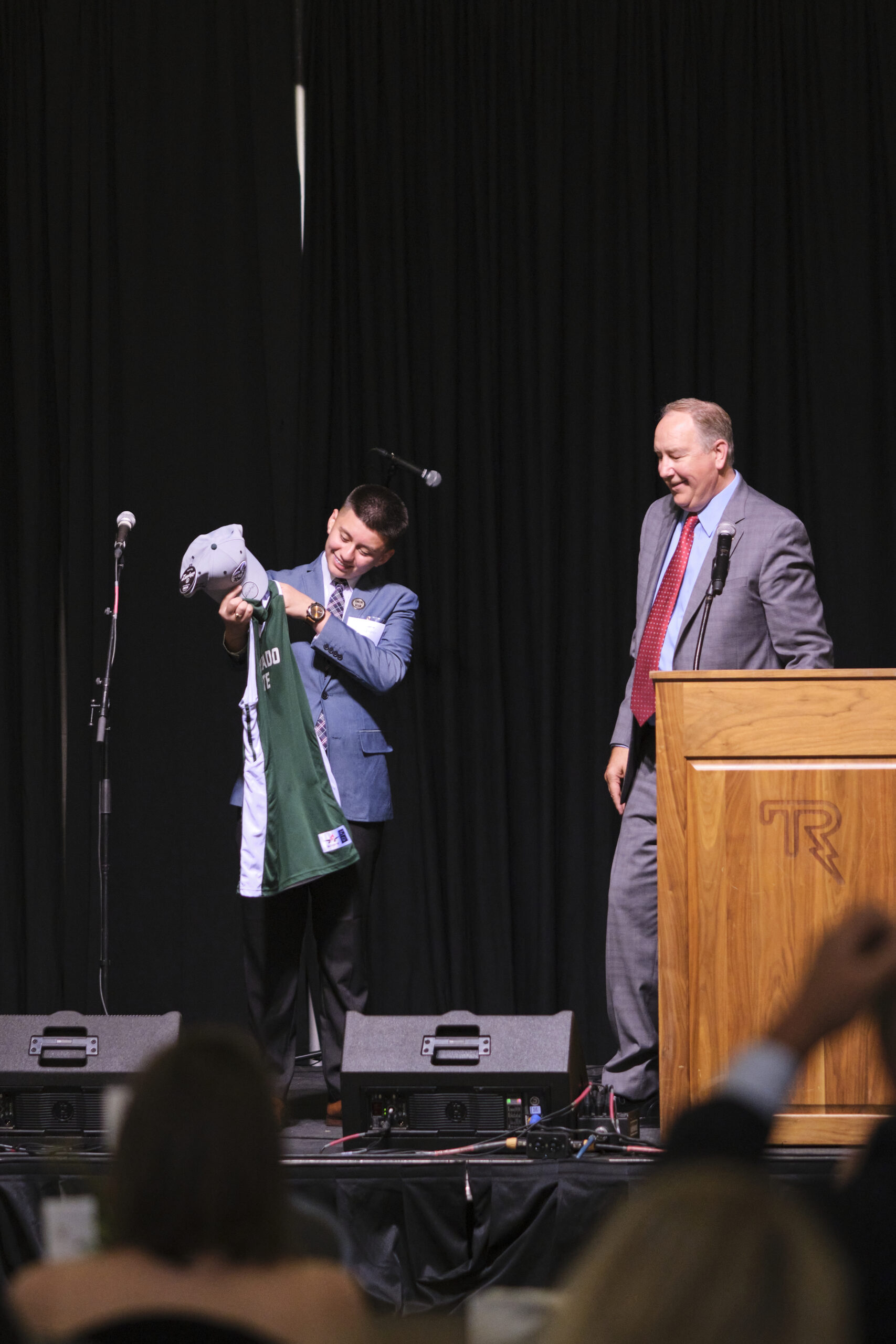 Bank of Colorado presenting the 2022 Youth of the Year with a signed CSI jersey